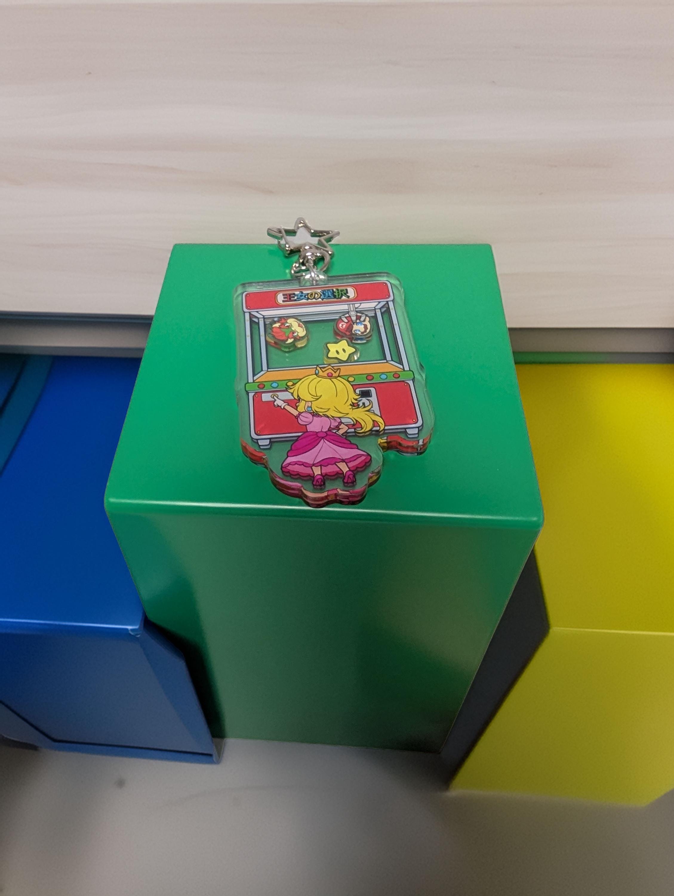 Princess' Choice Arcade shaker keychain inspired by Super Mario