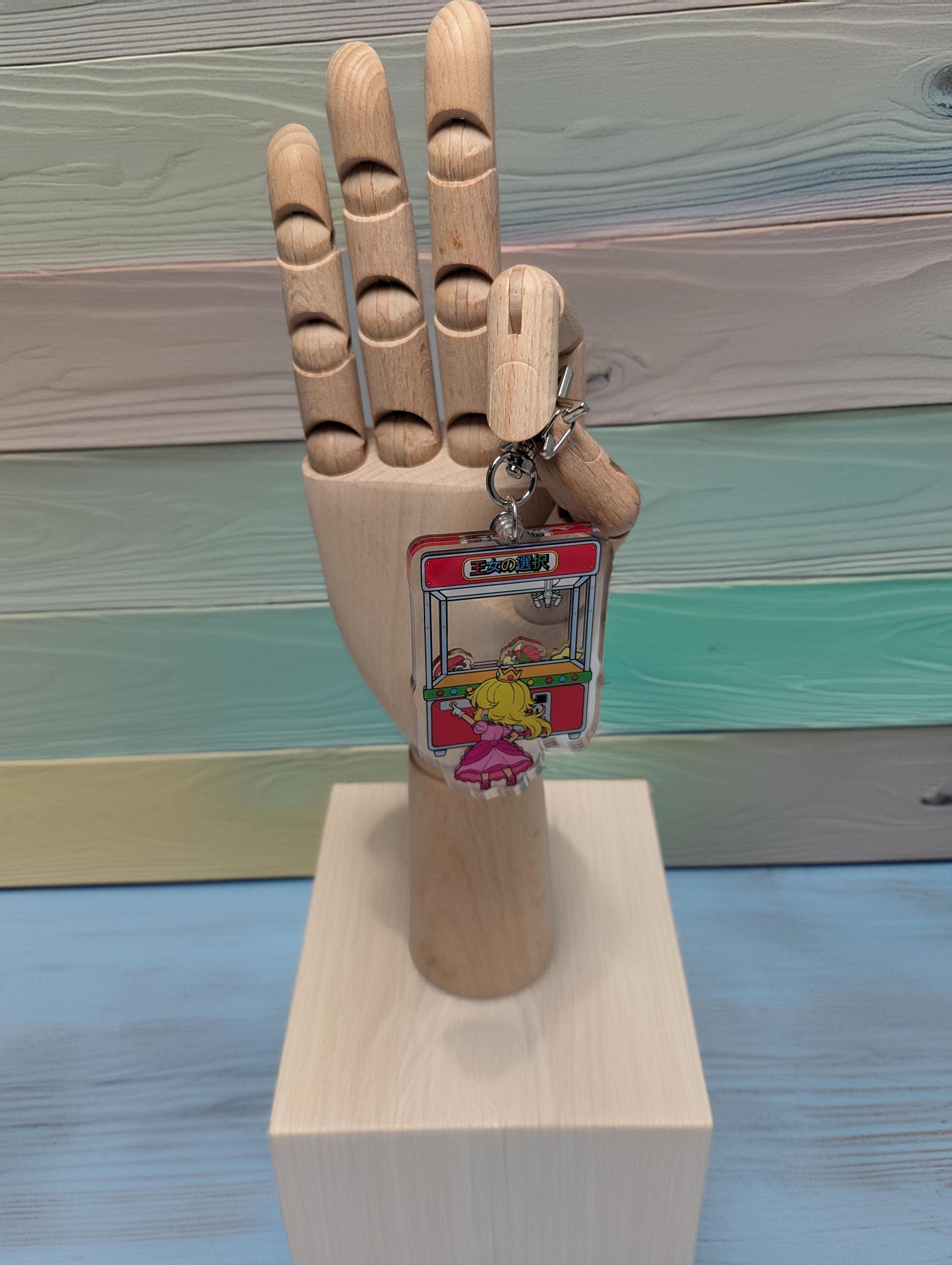 Princess' Choice Arcade shaker keychain inspired by Super Mario