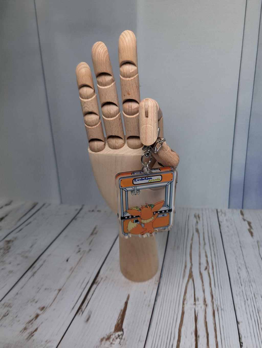 Evolution Arcade shaker keychain inspired by Eevee