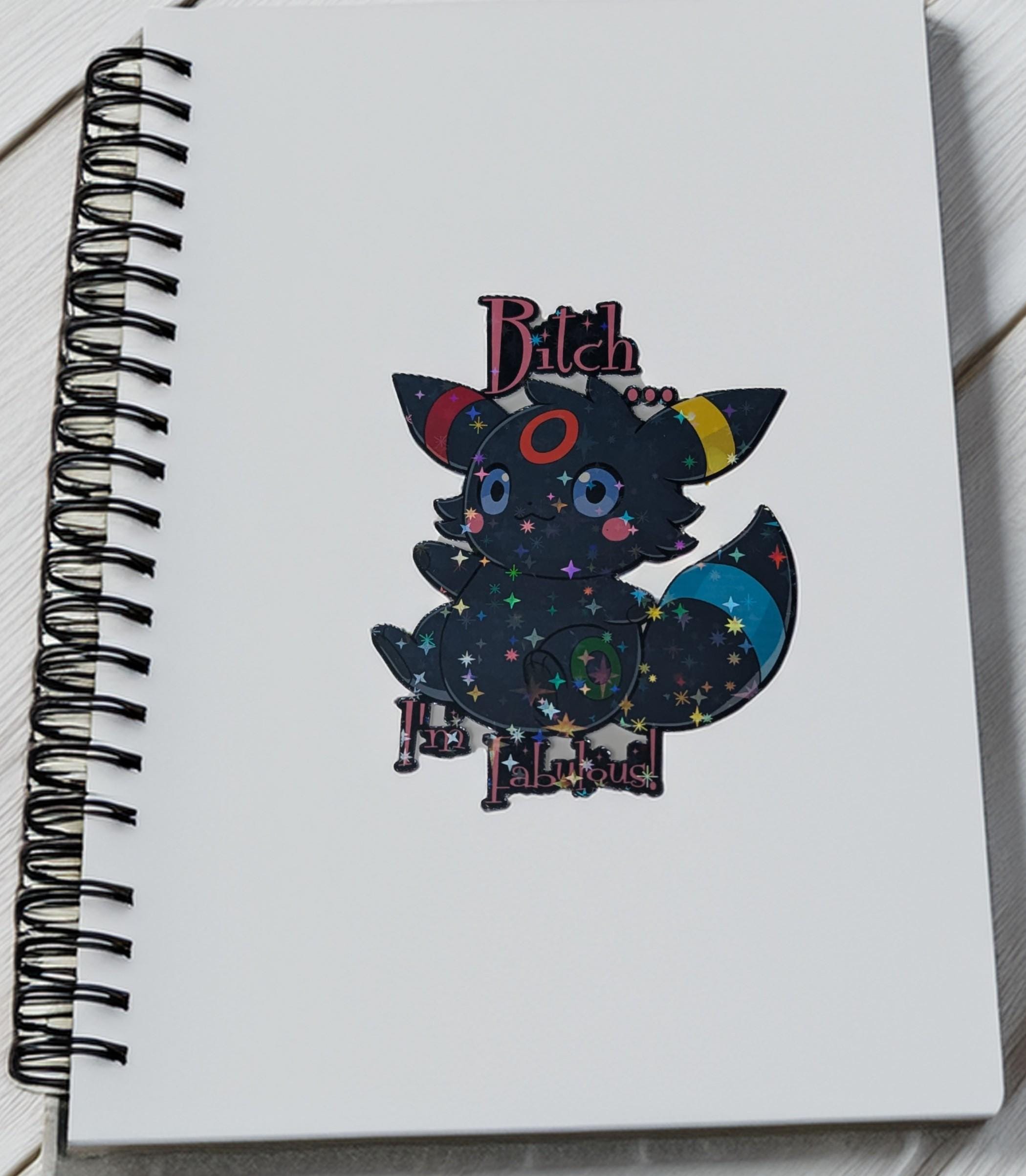 Notebook with a colorful fox illustration and text on a white background