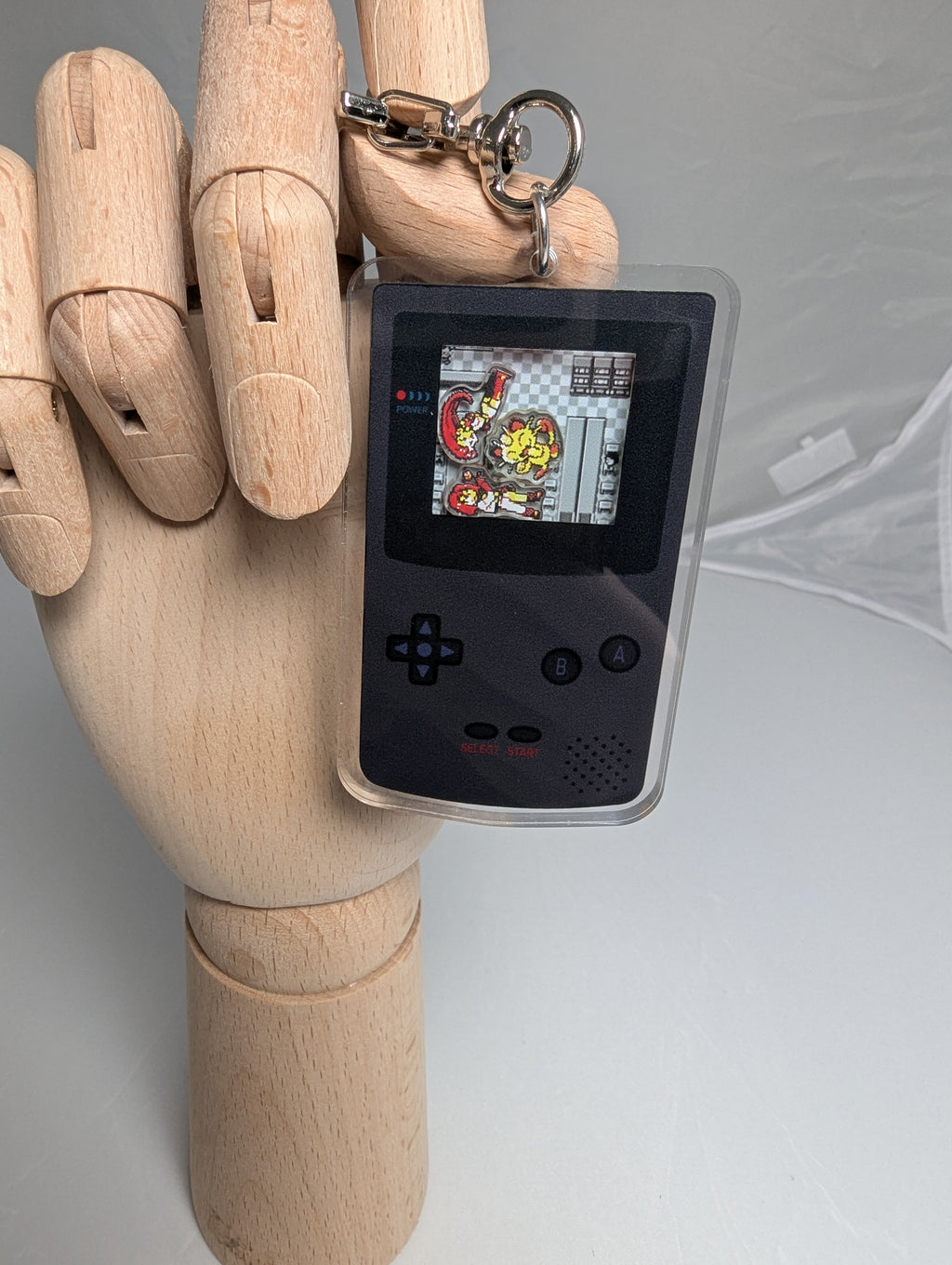 Gameboy shaker keychain inspired by Team Rocket of Pokemon