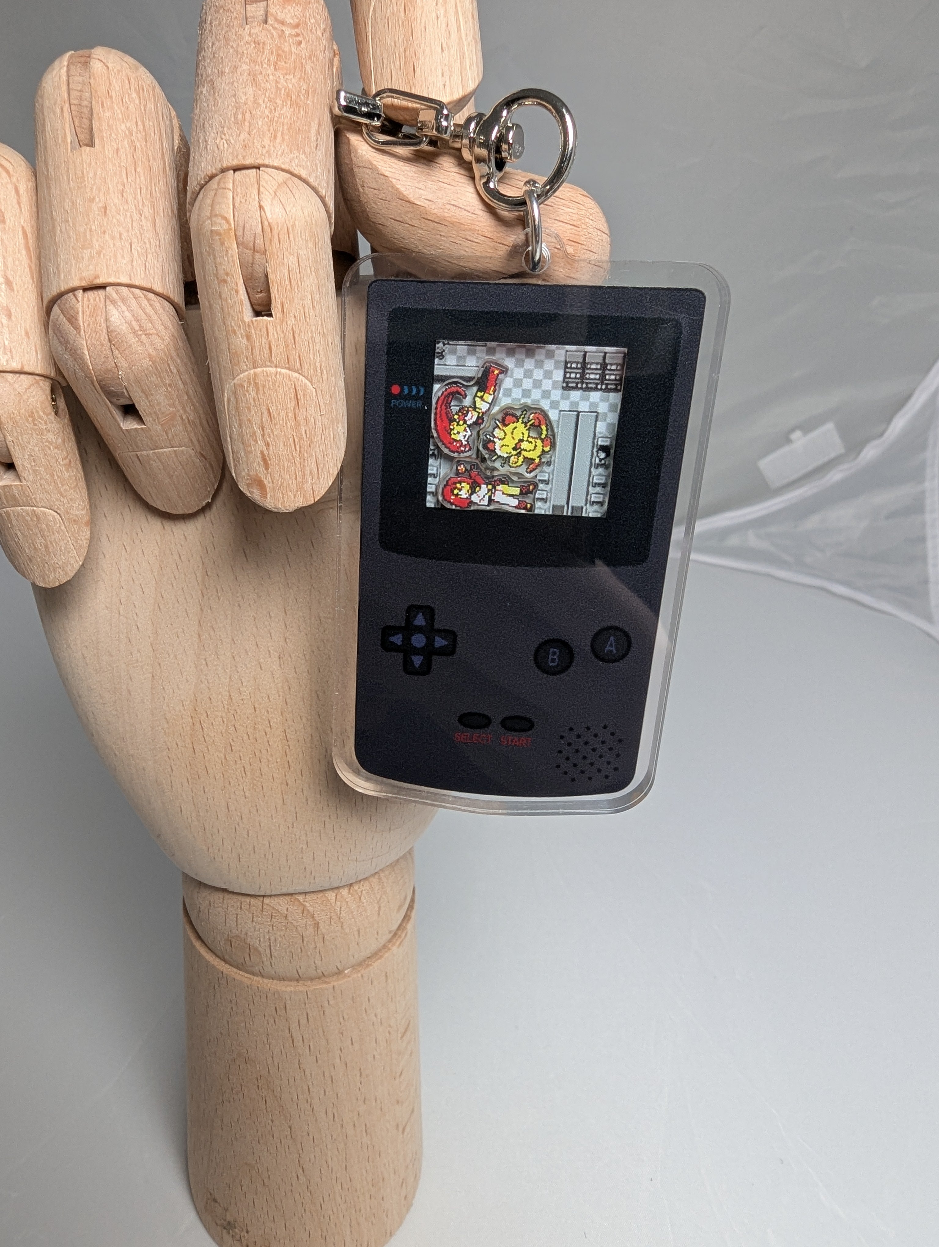 Gameboy shaker keychain inspired by Team Rocket of Pokemon