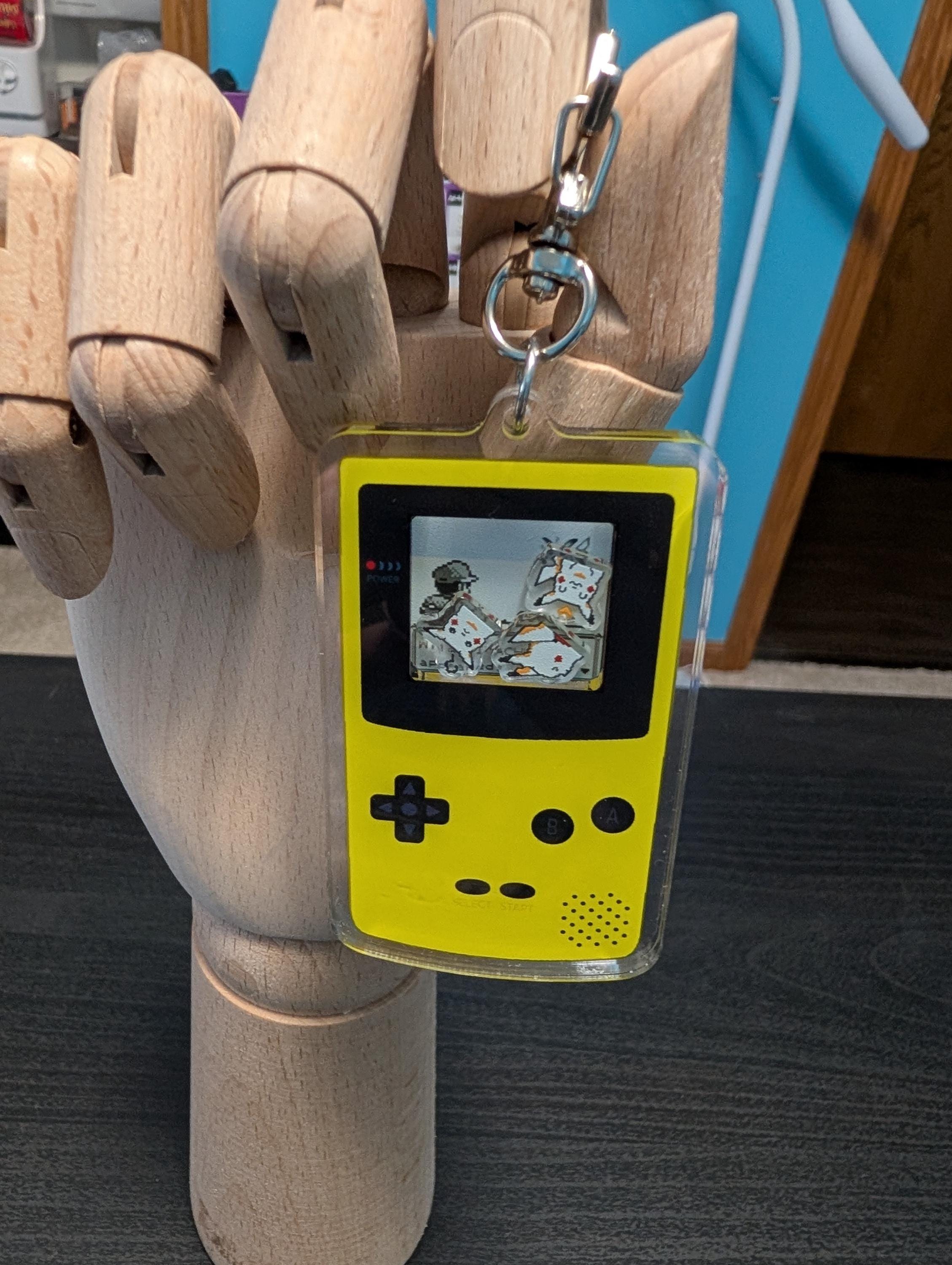 Gameboy shaker keychain inspired by Pokemon Yellow Version